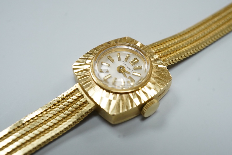 A lady's modern 18ct gold Cortebert manual wind wrist watch, with baton numerals, on 18ct gold integral strap, case diameter 18mm, overall length 17.7cm, gross weight 22 grams.